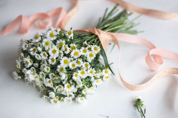 Tie your first yard of peach ribbon around the stems, near, but not right up against, the base of your flowers. Don